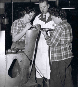 Women students learning riveting in the Aviation Mechanics program at Eugene Vocational School during World War II, circa. 1941-1945. LCC Archives, A-031, Box 4/11