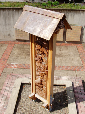 'Long Life' by Yoshiki Kawada, Shimada Mineo and students - view from above Students in Lee Imonen's site-specific sculpture class worked with two master woodcarvers from Japan to create a large, two-sided mahogany relief panel titled, "Long Life."