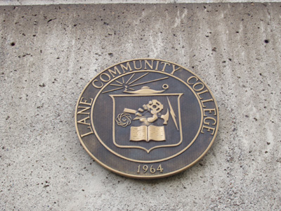 'Lane College Seal' by David Spriggs College seal was designed in 1964 by David Spriggs, a student at Eugene Technical Vocational School and Lane Community College.