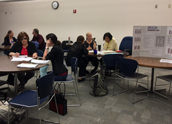 faculty at assessment team table session fall in-service 2016