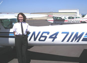 Woman standing in front of a plane