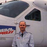 Man standing in front of a plane