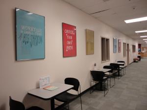 Hall outside career center with posters and work tables