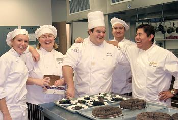 happy students in demonstration kitchen