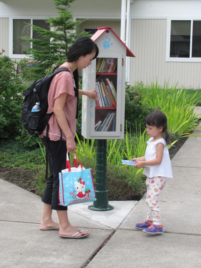 mother and daughter look for book