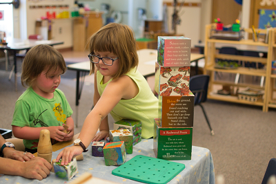 children playing with puzzles and blocks