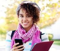 Female college student holding phone and notebook