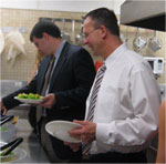 Committee members sampling food