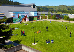 students in the commons by the center building