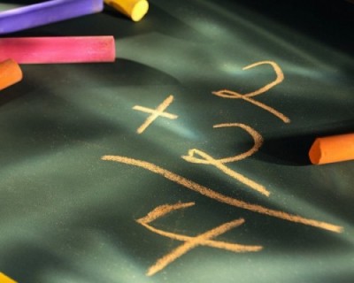 2 + 2 = 4 chalkboard graphic