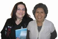 Two women standing next to each other smiling