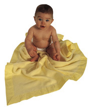 baby on yellow blanket