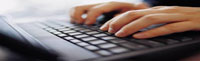hands typing on keyboard