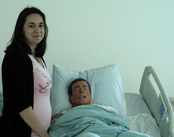 LPN student Diana Ambroson with “sim-man” in LCC nursing lab