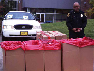 Lane Community College Public Safety Chief with Take-Back Day collection bins