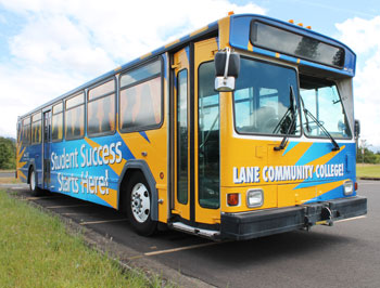 picture of Lane's bus with Success paint in yellow and blue