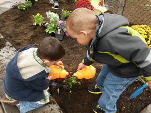 Lane Child and Family Center children planting flowers