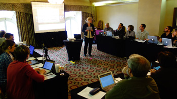 Dr. Anne McGrail (center) leads a digital humanities discussion