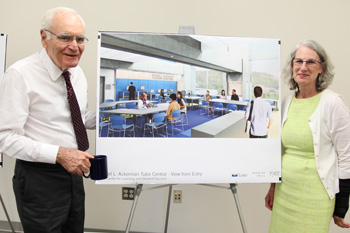 Bob Ackerman and Mary Spilde with architect drawing