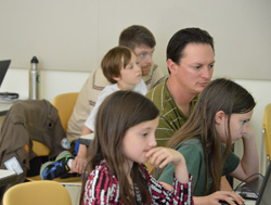 image of Families enjoying coding at the 2014 Hour of Code