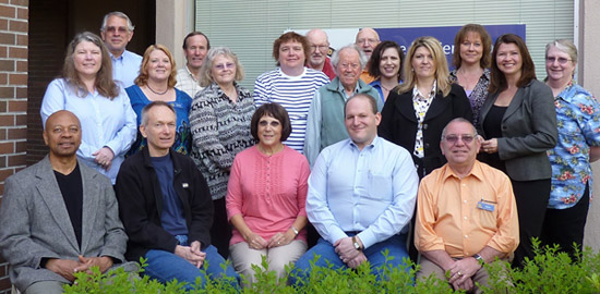from left, standing (middle): Diane Pigg, Melody Stuart, Rosemary Busby, Suzanne Penegor, Bill Sarnoff, Ame Beard, Tina Thomas, and Bristol Kelley; from left (back): Tim Armstrong, John Costello, Dallas Guard, Gary Schweitzer, Kim Chevalier, and Rhonda Johnson; seated, from left: Ron Tinsley, Frank Plaisted, Shirl Meads, Gary Smith, and James Burke