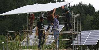 image of workers installing solar panels