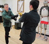 fencing master Sean Hayes instructing student