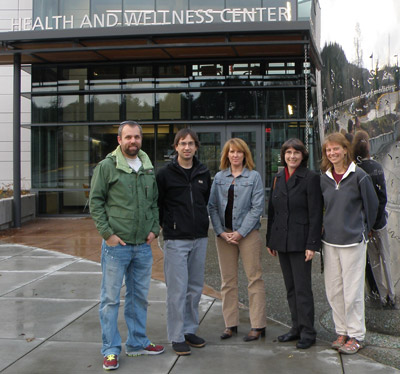 Physical Therapist Assistant grads pose outside the Health and Wellness Center at Lane Community College. From left: Ian Standish, Damien Kruziki, Marie Williamson, JoNel Hood, and Shannon Gaul