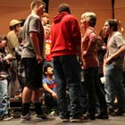 Debi Noel Discussing Solo Pieces with Choir Members