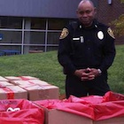 LCC public safety officer standing with collection containers