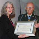 President Mary Spilde and veteran Robert Maxwell