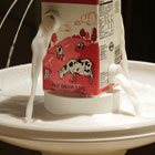 image of “Milk”,a container with multiple spouts, into bowl