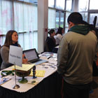 image of students and Scholarship Workshops signup desk