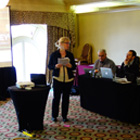Dr. Anne McGrail (center) leads a digital humanities discussion