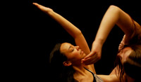 artistic image of two dancers against black background
