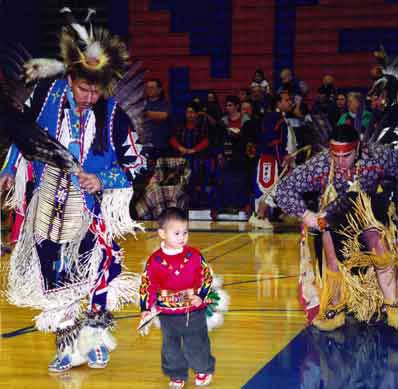 Native American Pow wow with child and adult dancing