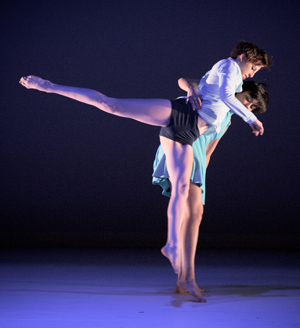 sepia photo of lane dance company performing on stage
