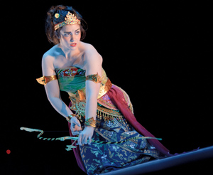 Dance with bow and arrow performipng on stage