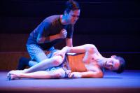 two theatre students performing in production