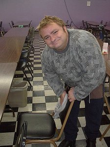 Student-Worker cleaning chair