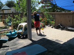 A young woman is gaining work experience at a child care center