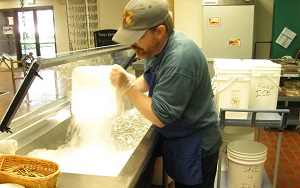 Worker prepping in deli area