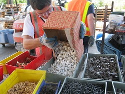 A young man is organizing building materials