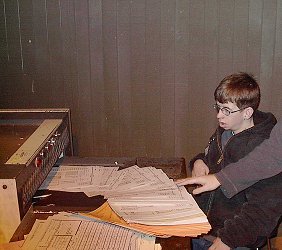 Student worker shredding paper