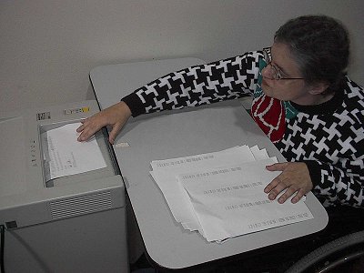Student Worker Shredding Paper