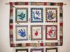 The Heart and Hand Quilts were made in memory of Joan Thomas, a Mathematics instructor who died of breast cancer in 2001. The hearts and hands on the quilts are symbols of caring and helping. The hands included in the quilts include those of her husband, daughter, and Mathematics staff and instructors.