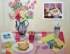 'Art Lunch' by Madeliene Liepe. A pastel painting of a table with flowers, paints and food