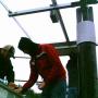 Students installing solar panel